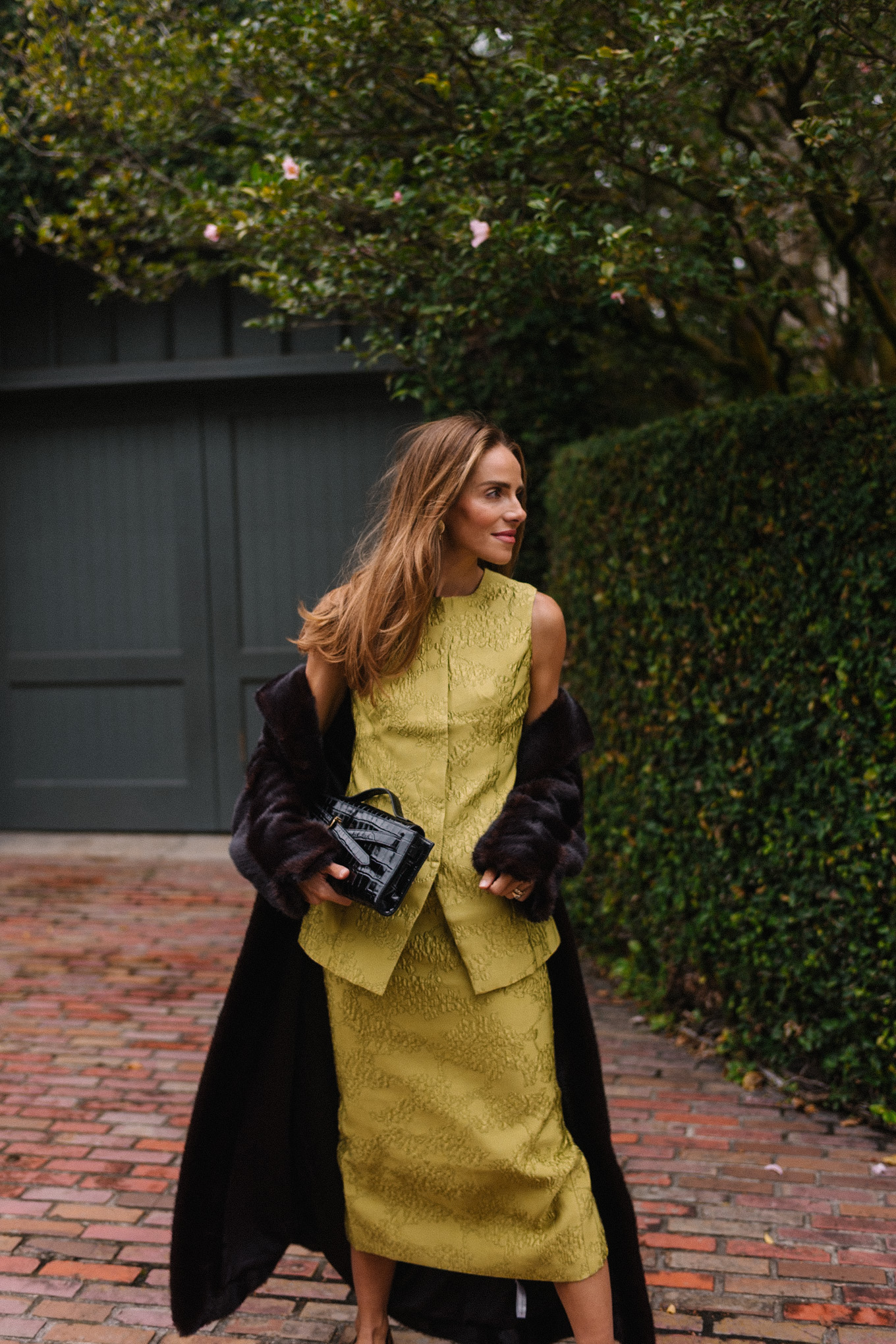 chartreuse top and skirt set black long coat black handbag leopard pumps