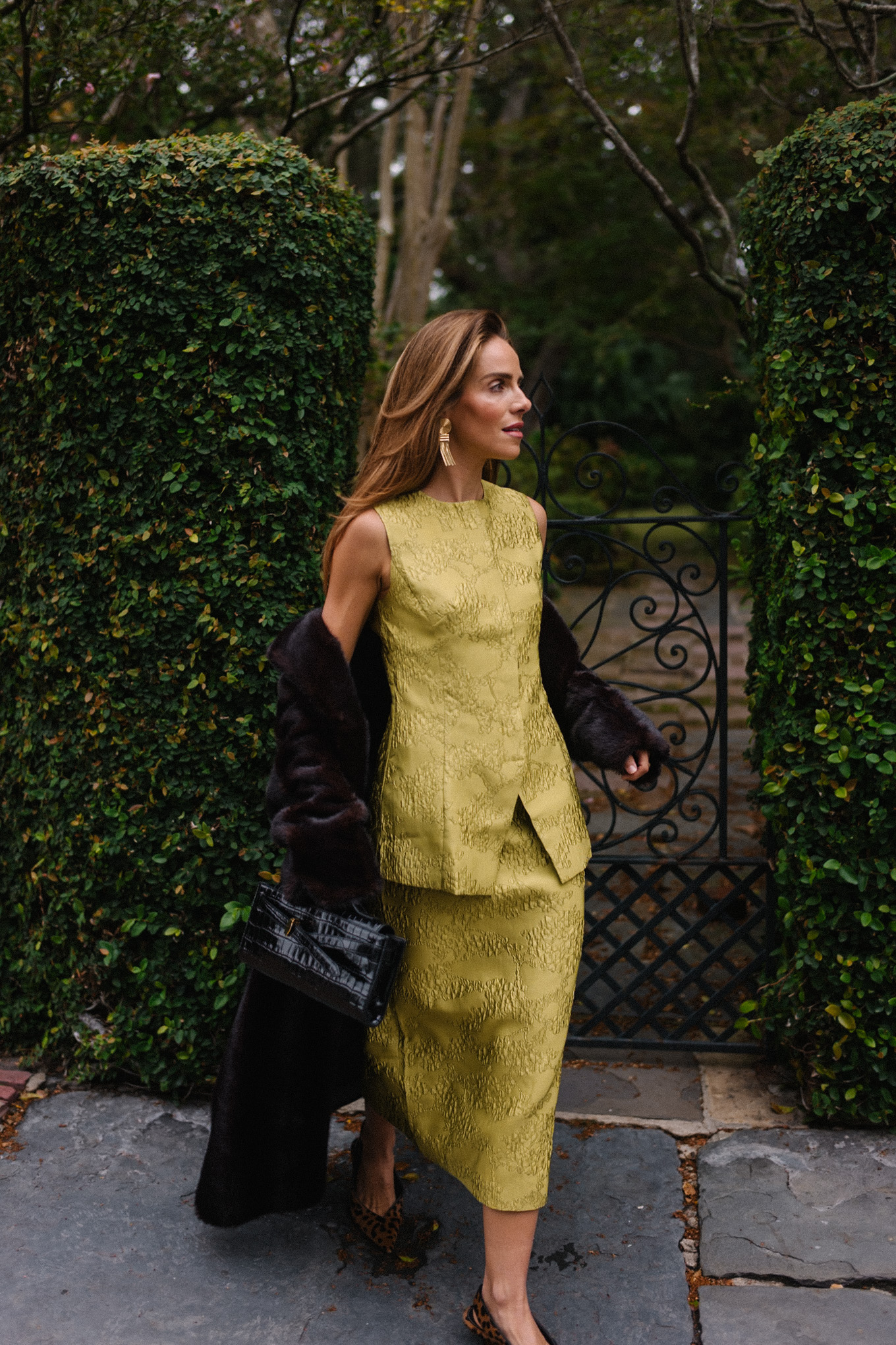 chartreuse top and skirt set black long coat black handbag leopard pumps