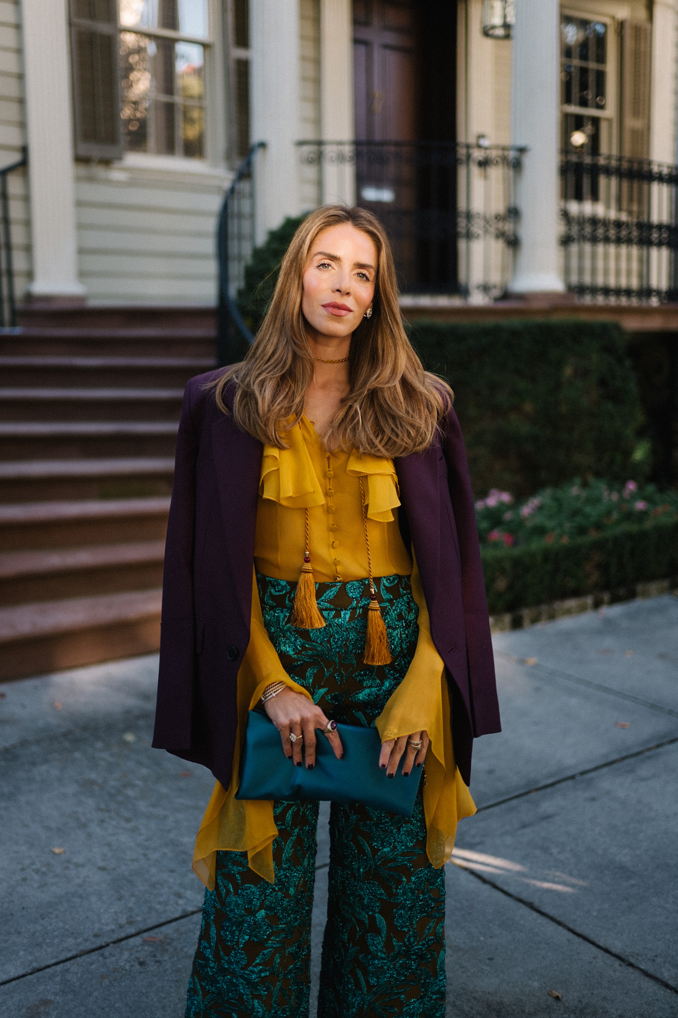 plum blazer gold ruffle blouse jacquard pants turquoise clutch purple pumps