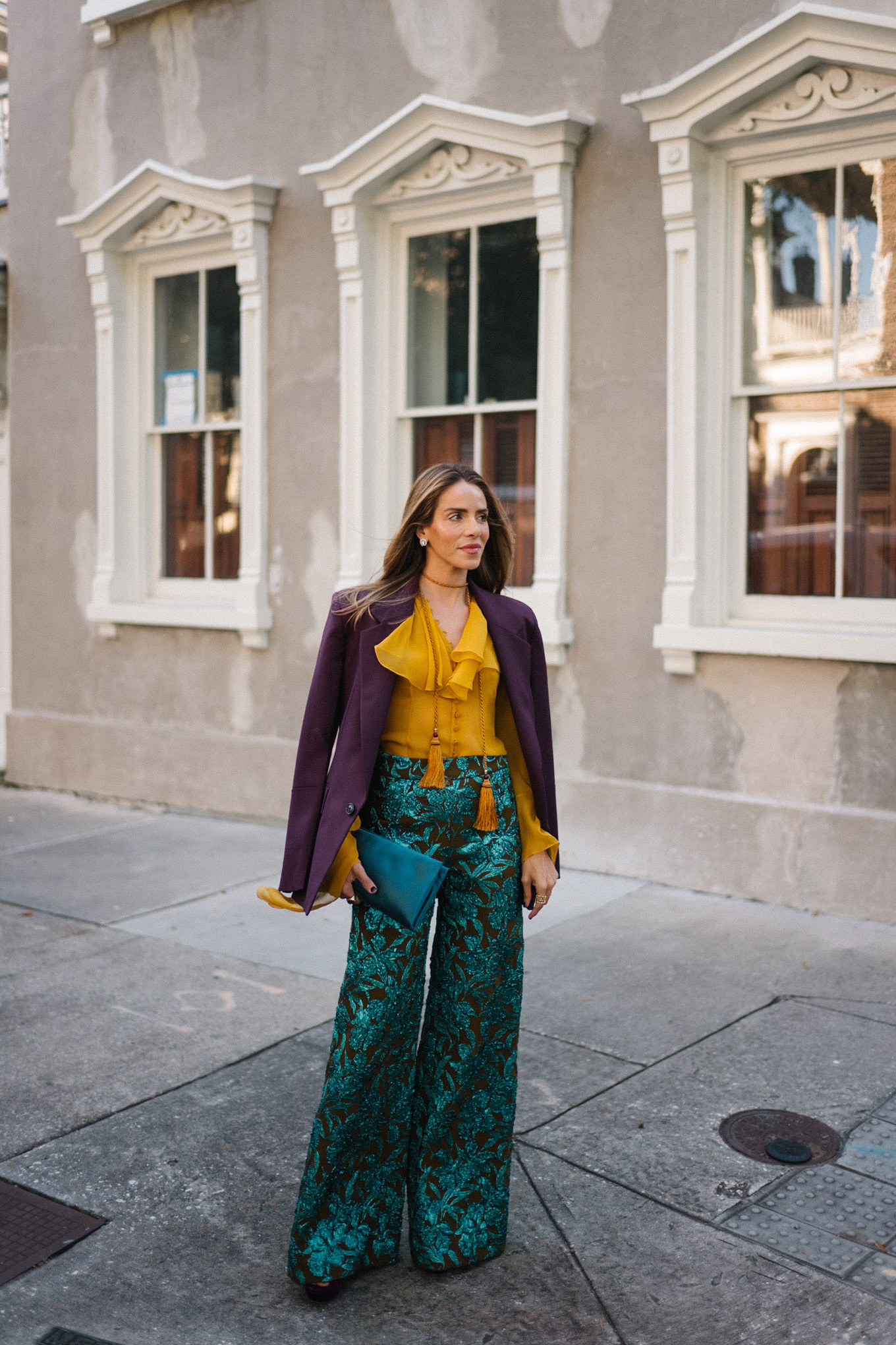 plum blazer gold ruffle blouse jacquard pants turquoise clutch purple pumps