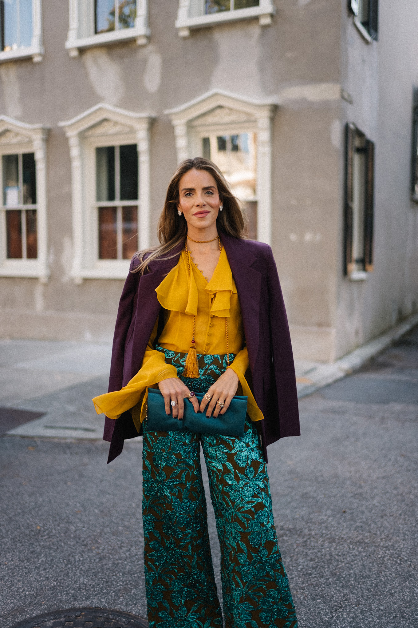 plum blazer gold ruffle blouse jacquard pants turquoise clutch purple pumps
