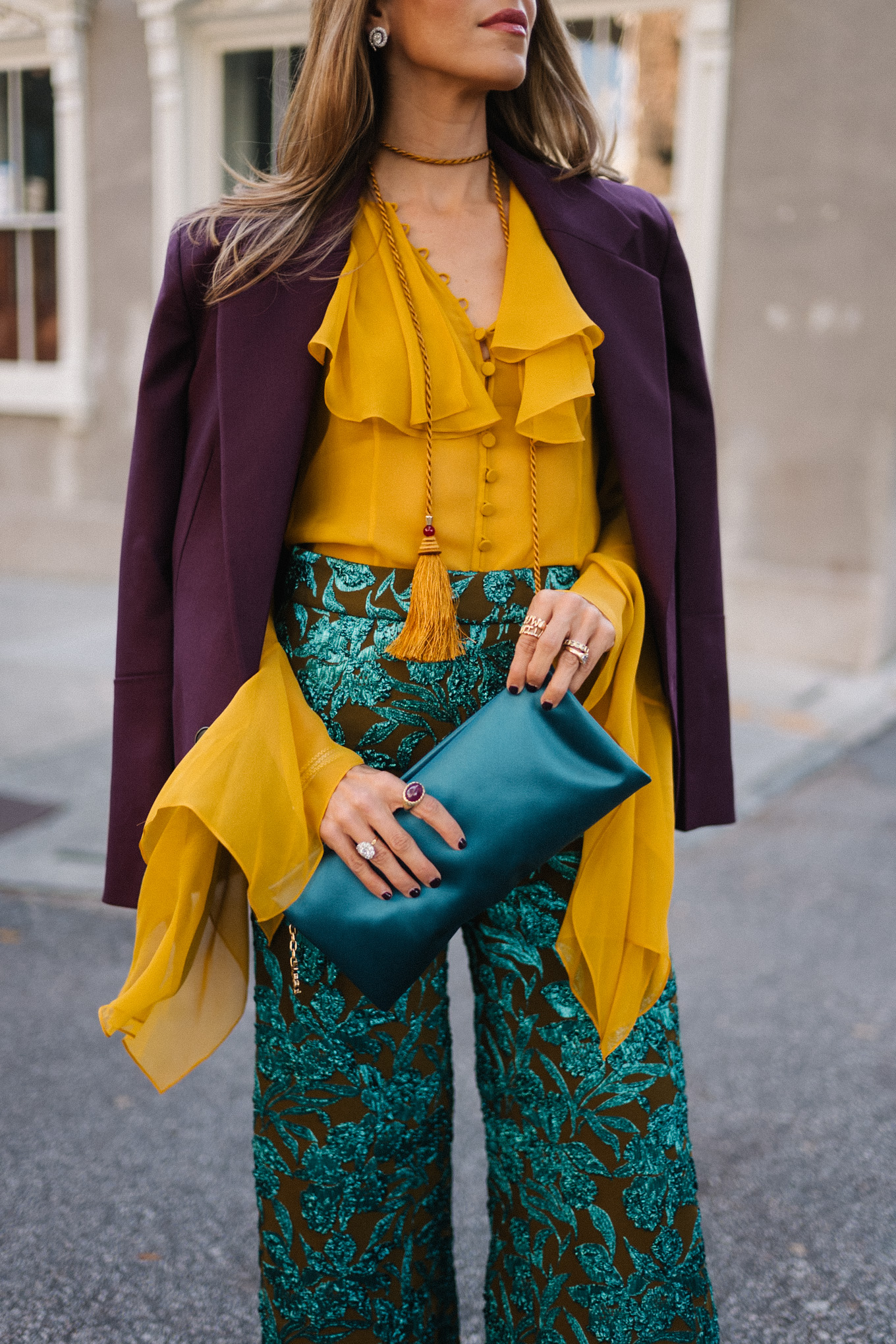 plum blazer gold ruffle blouse jacquard pants turquoise clutch purple pumps