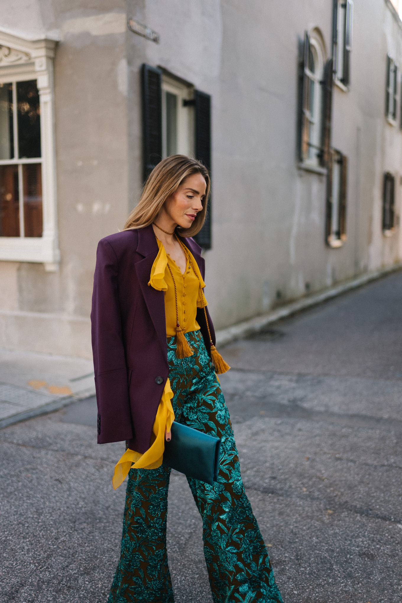 plum blazer gold ruffle blouse jacquard pants turquoise clutch purple pumps