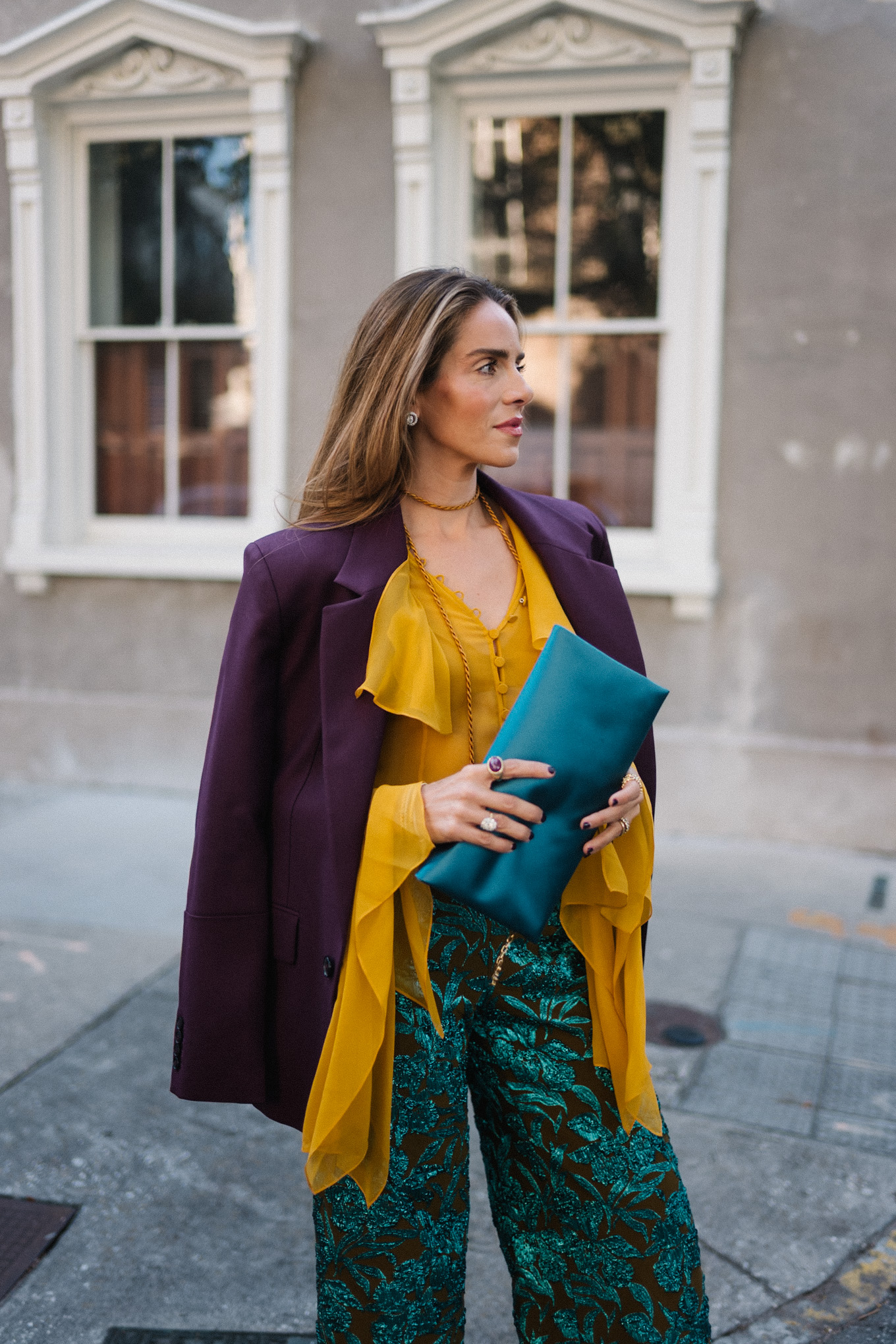 plum blazer gold ruffle blouse jacquard pants turquoise clutch purple pumps