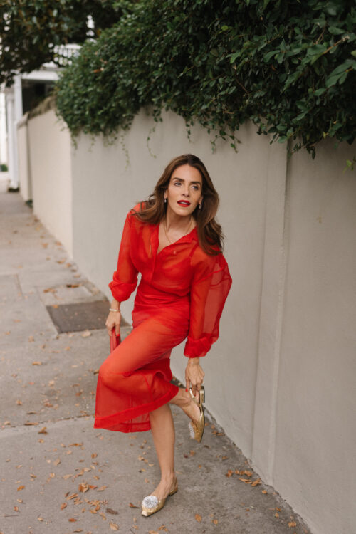 red sheer blouse red sheer skirt red handbag sparkle flats