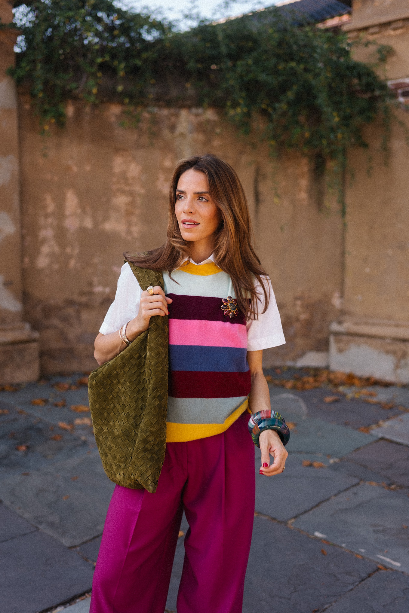 rainbow stripe sweater vest magenta satin pants green suede tote