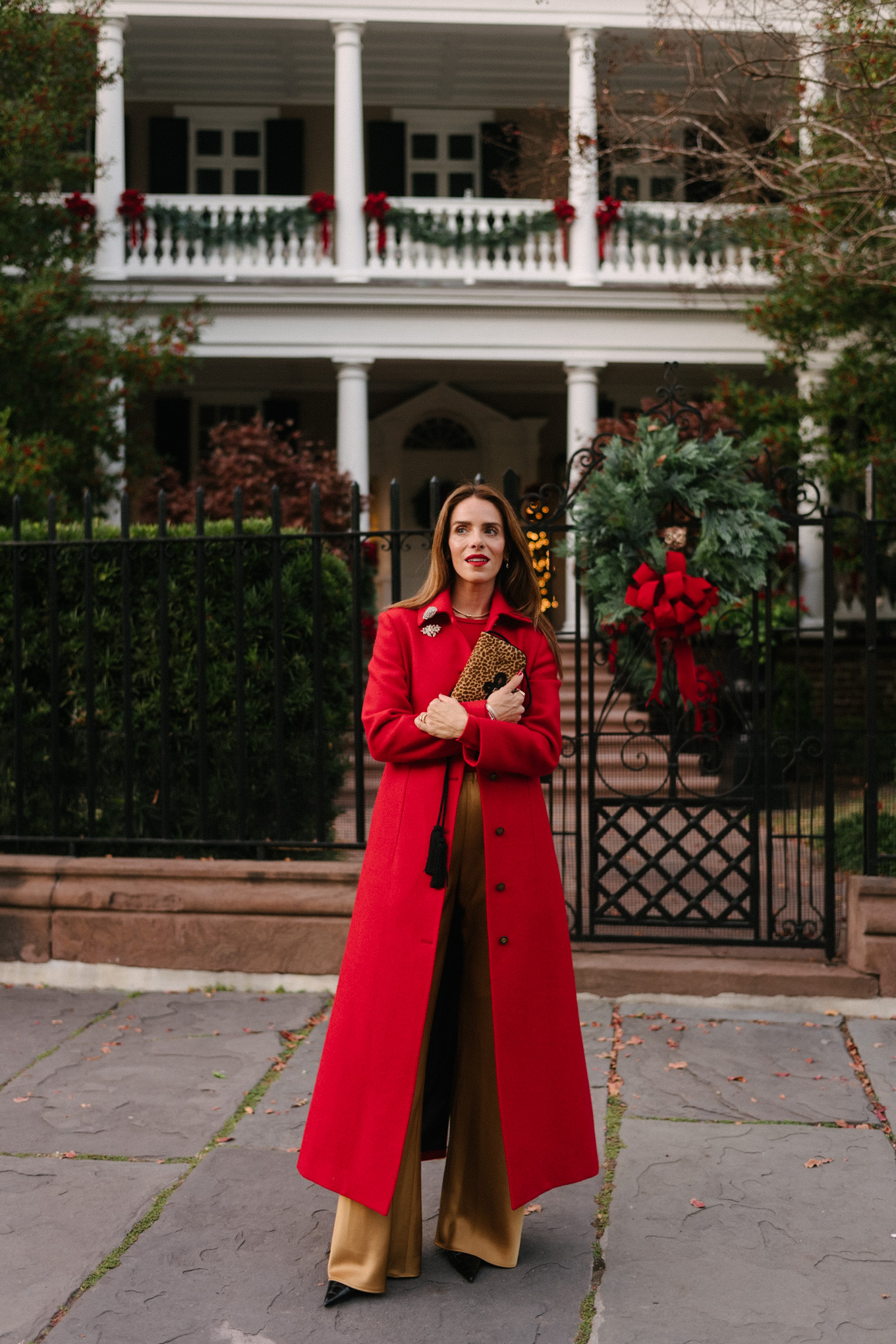 red wool coat red bodysuit gold satin pants leopard handbag