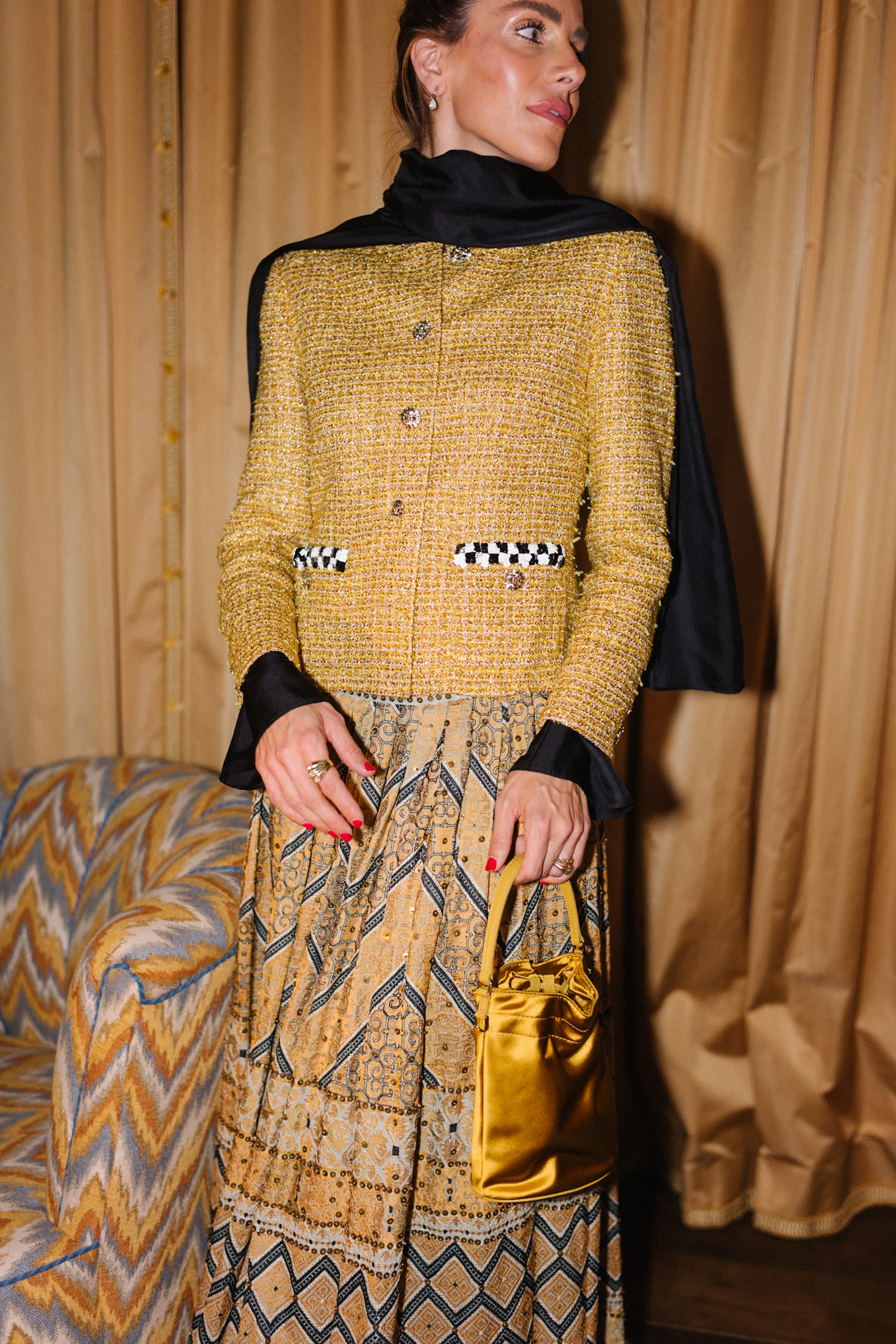 gold tweed jacket gold print skirt gold silk bucket bag black scarf black boots