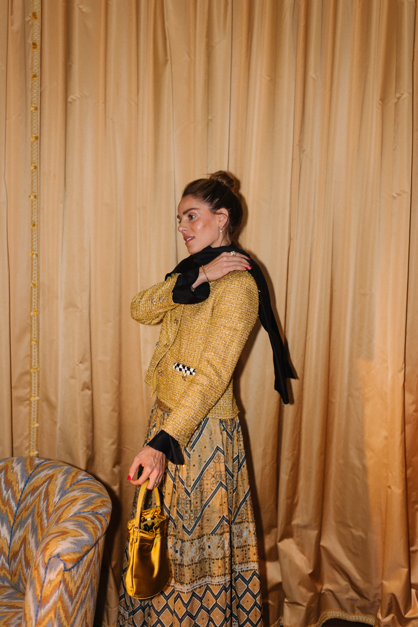 gold tweed jacket gold print skirt gold silk bucket bag black scarf black boots