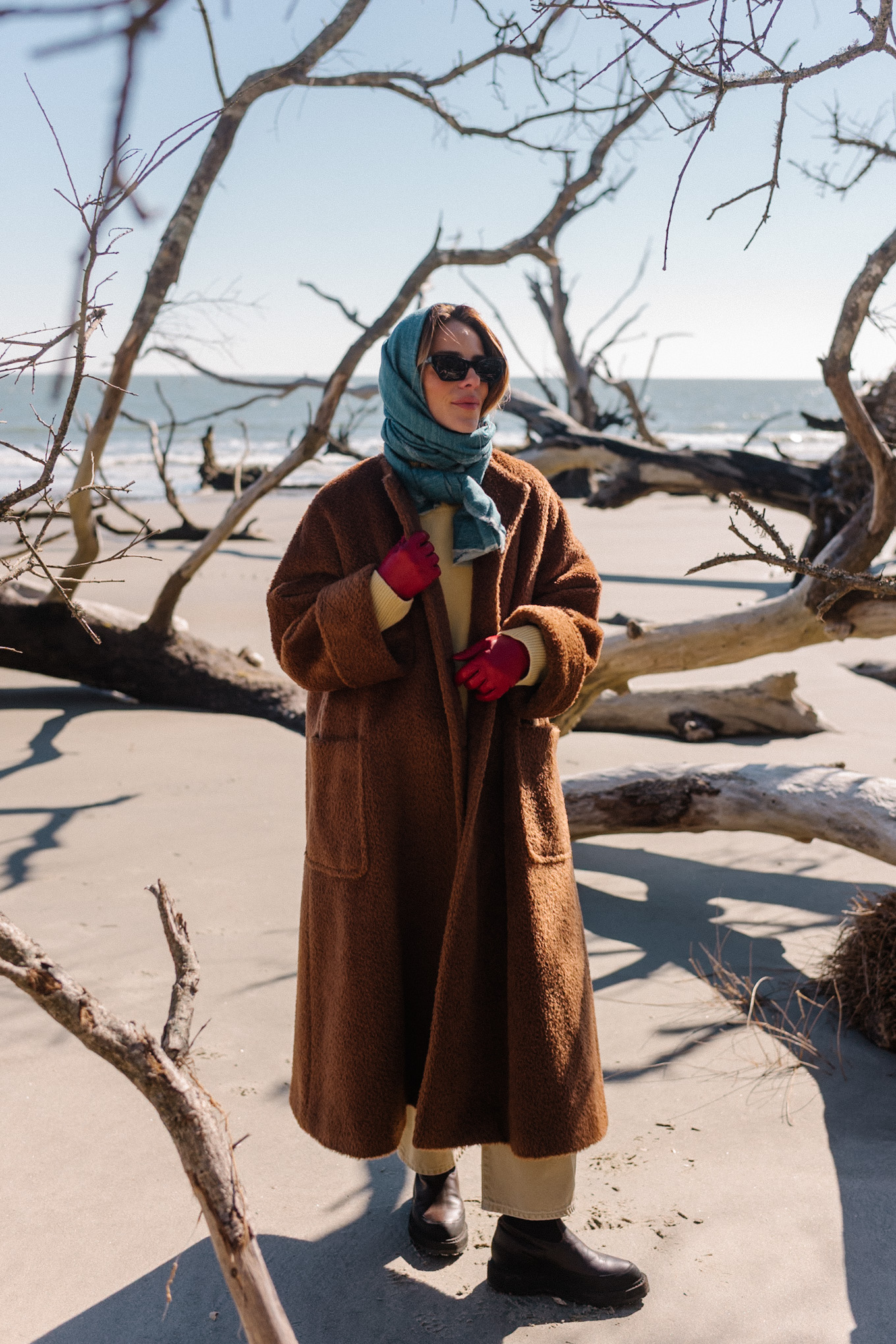 Brown oversized fleece coat Blue scarf Yellow sweater Cream denim Brown boots