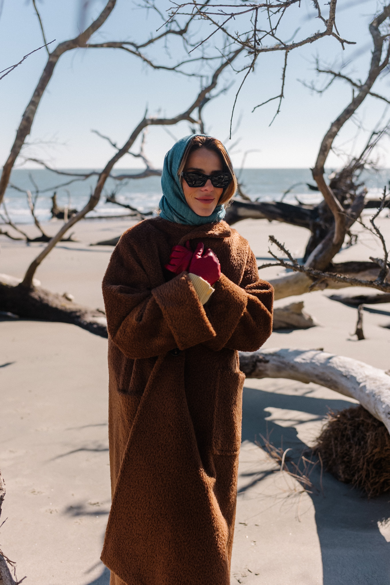 Brown oversized fleece coat Blue scarf Yellow sweater Cream denim Brown boots