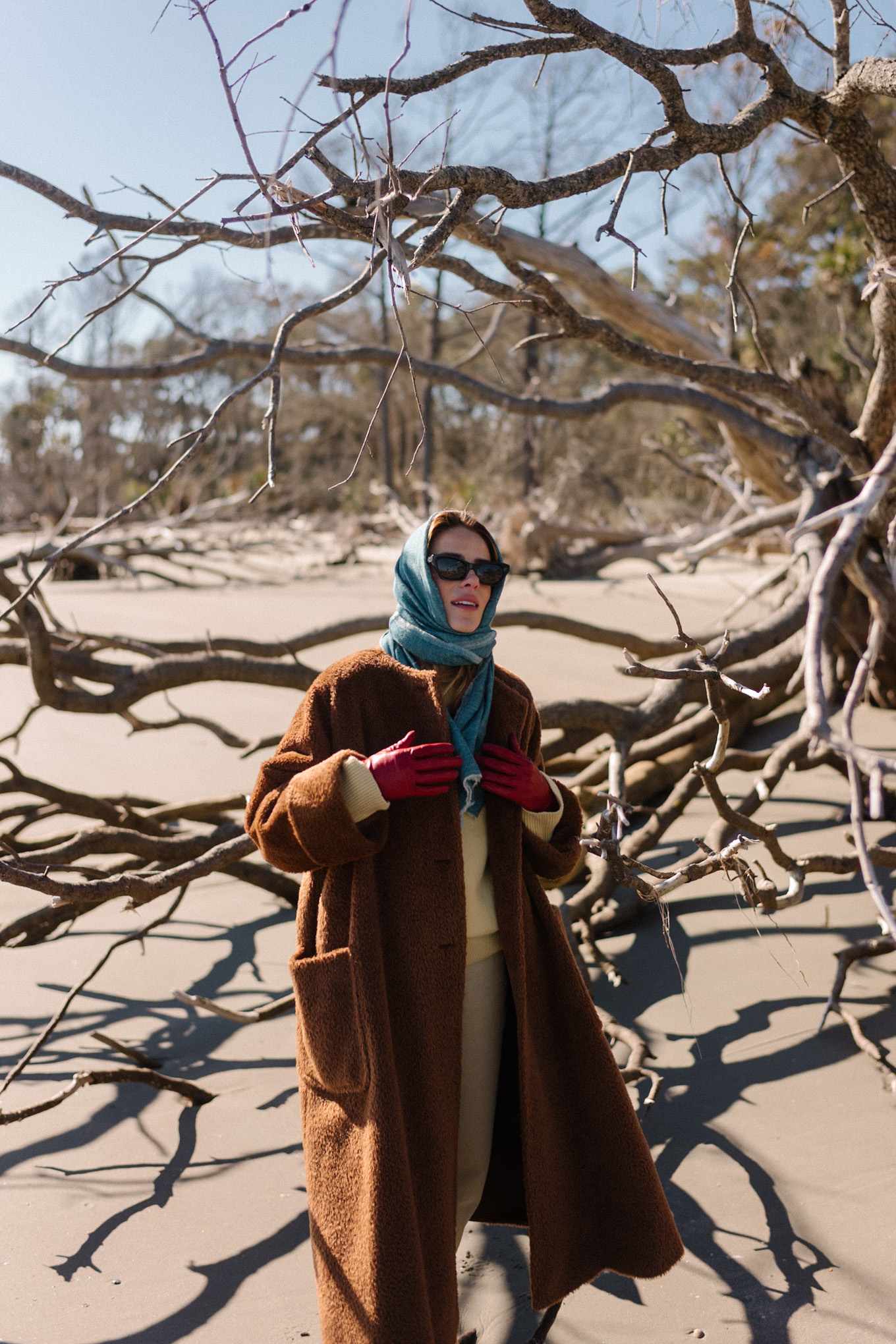 Brown oversized fleece coat Blue scarf Yellow sweater Cream denim Brown boots