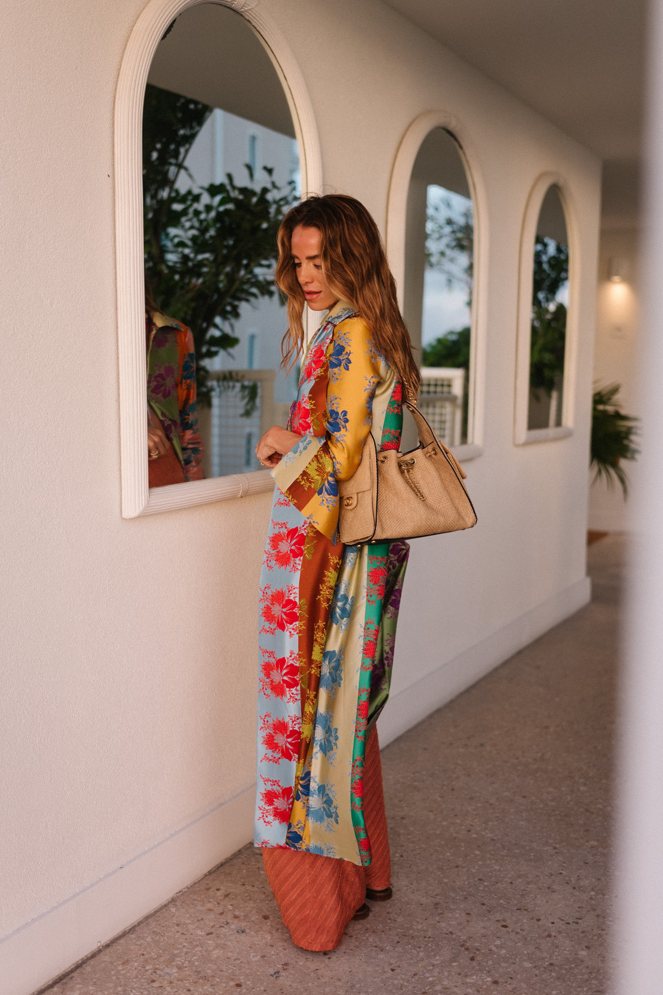 rainbow floral silk jacket silk wide leg pants rainbow beaded necklace rattan bag