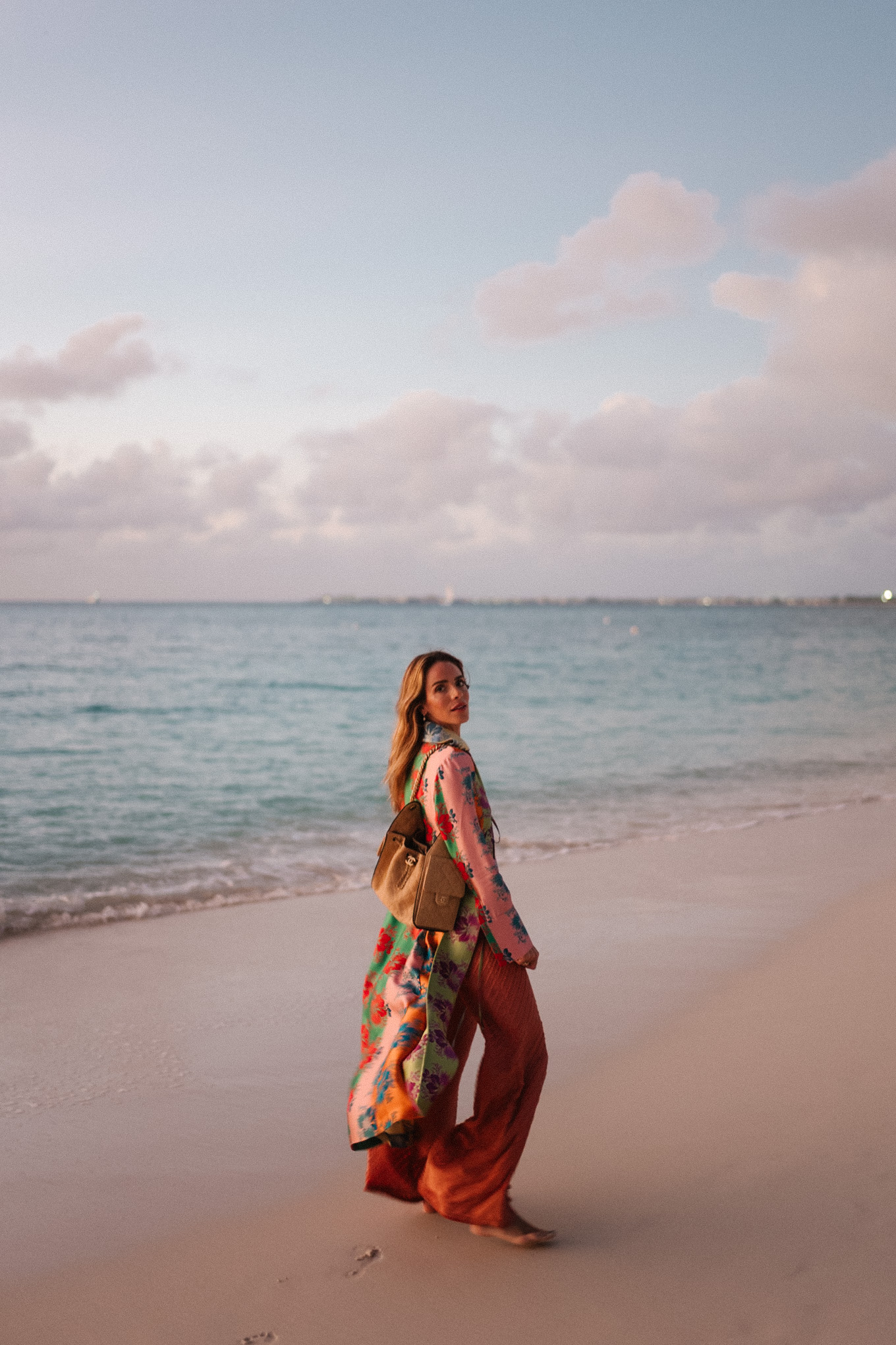 rainbow floral silk jacket silk wide leg pants rainbow beaded necklace rattan bag