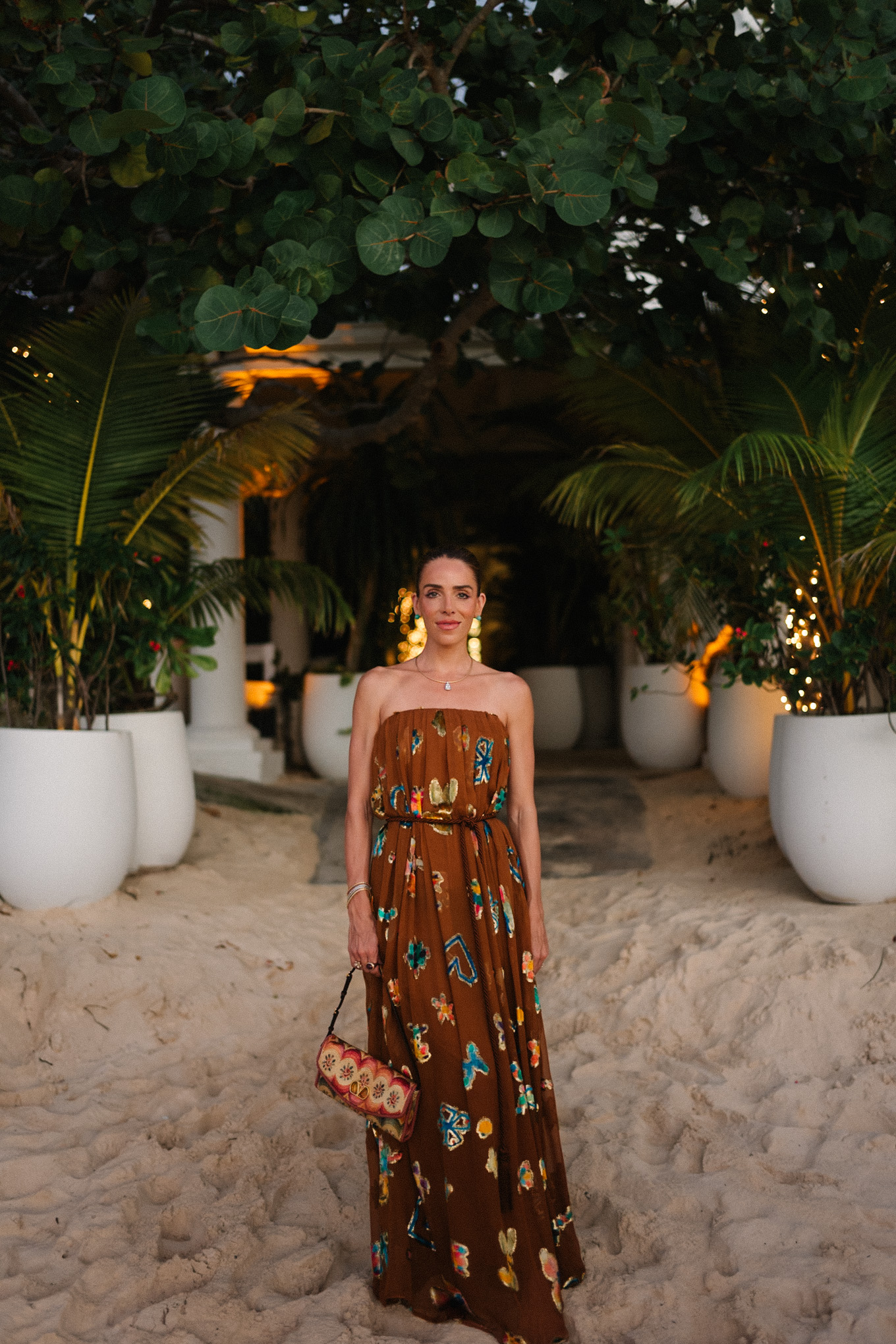 brown strapless maxi dress woven rainbow handbag