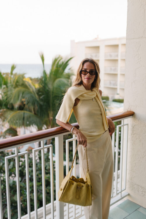 butter yellow sweater tank pants and handbag