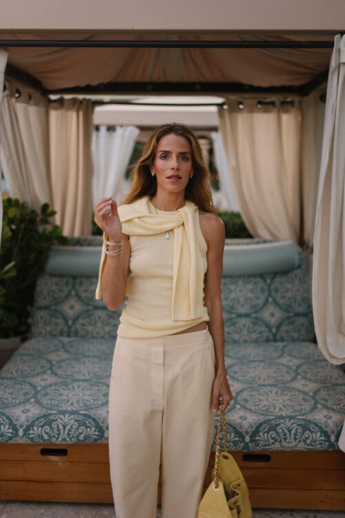butter yellow sweater tank pants and handbag