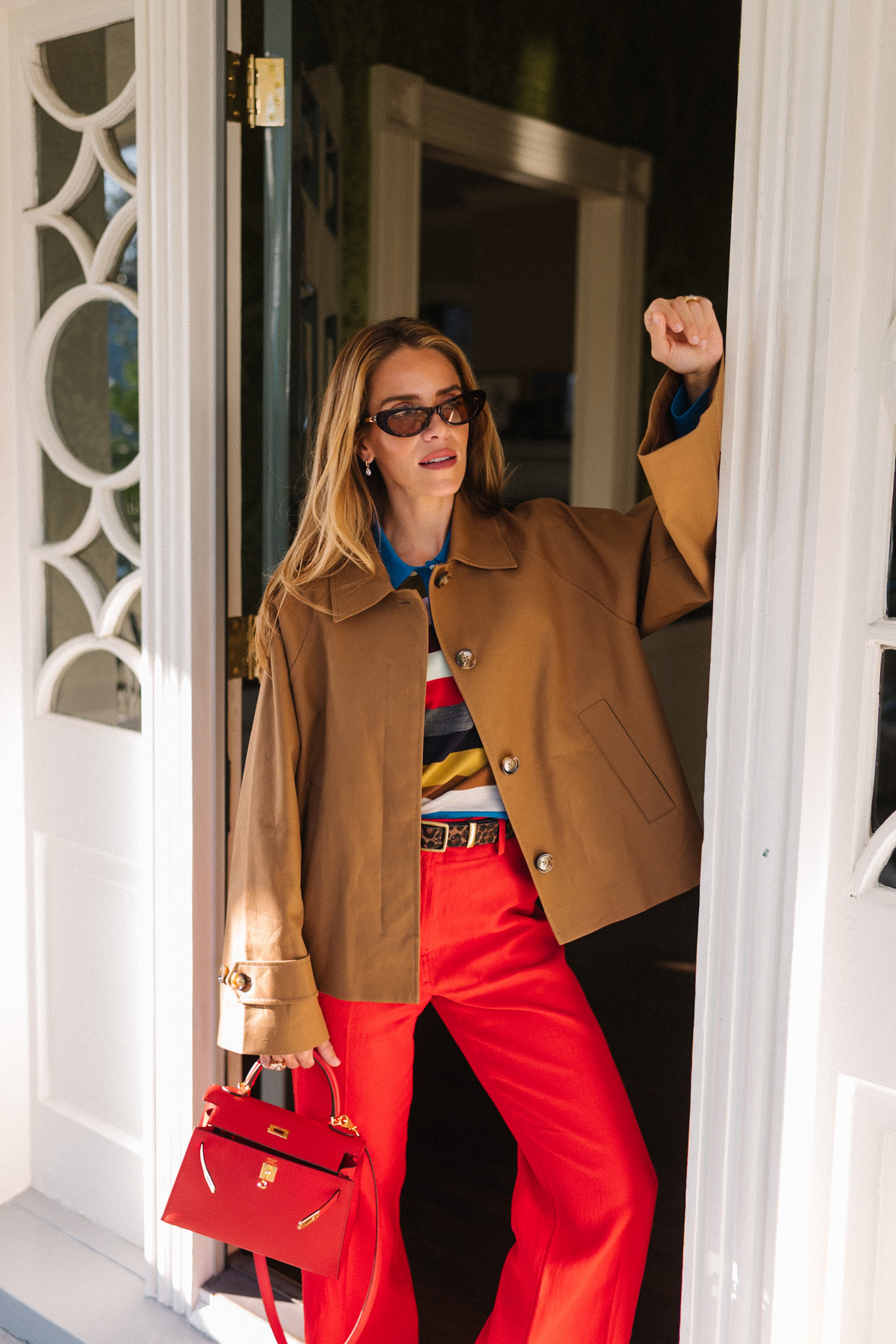 brown cropped trench striped collared shirt red pants red leather handbag