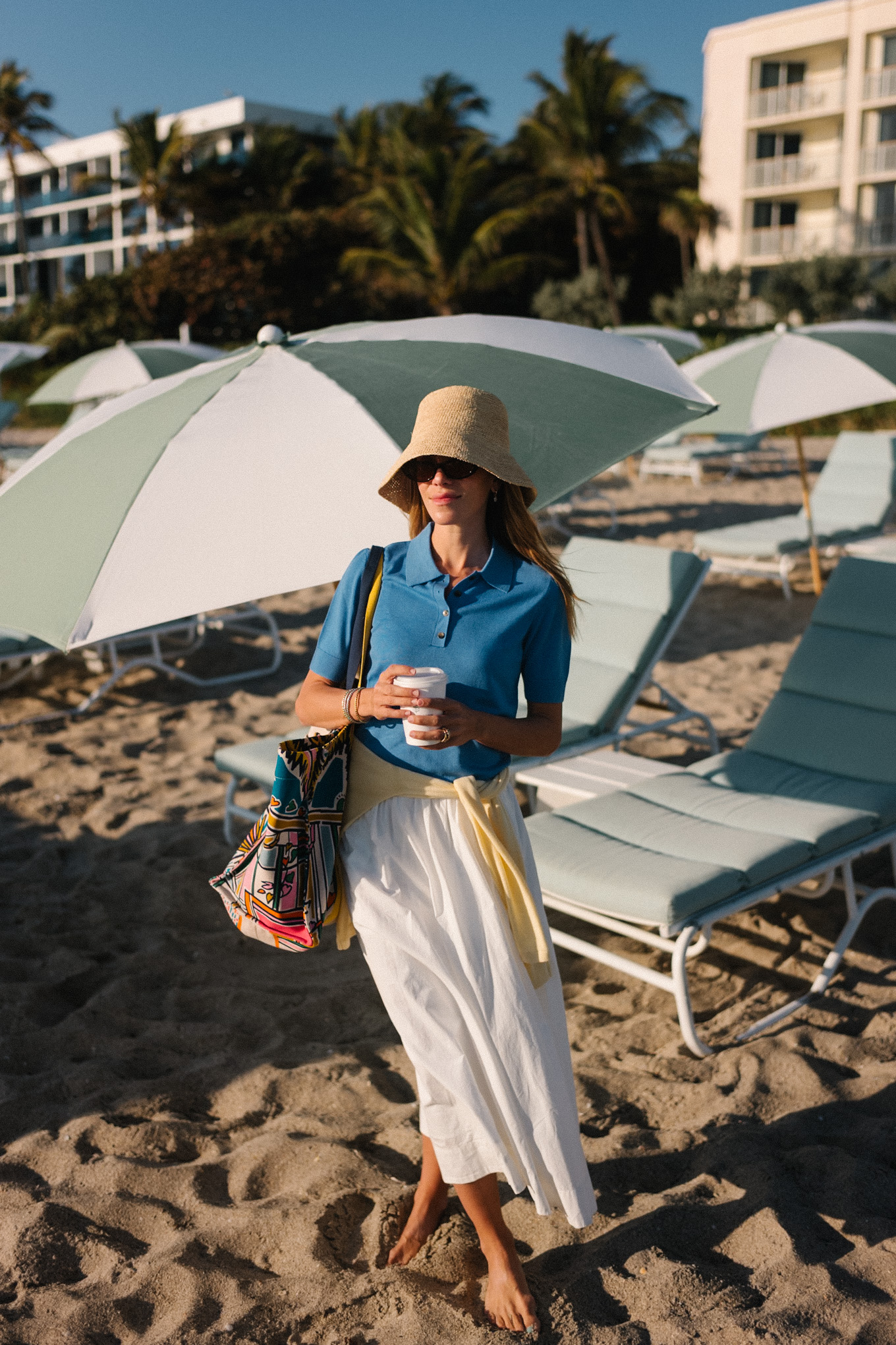 blue collared short sleeved sweater yellow sweater white maxi skirt raffia bucket hat