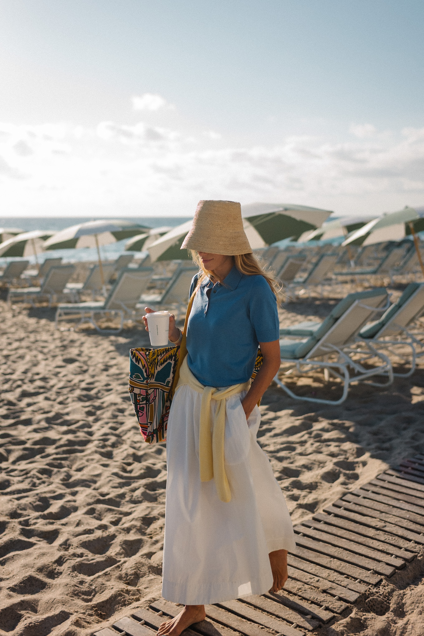 blue collared short sleeved sweater yellow sweater white maxi skirt raffia bucket hat