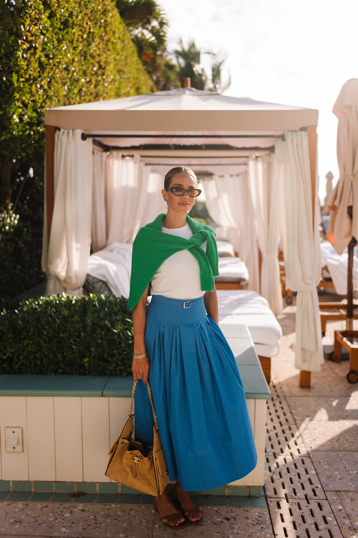 white tshirt green sweater blue maxi skirt raffia tote