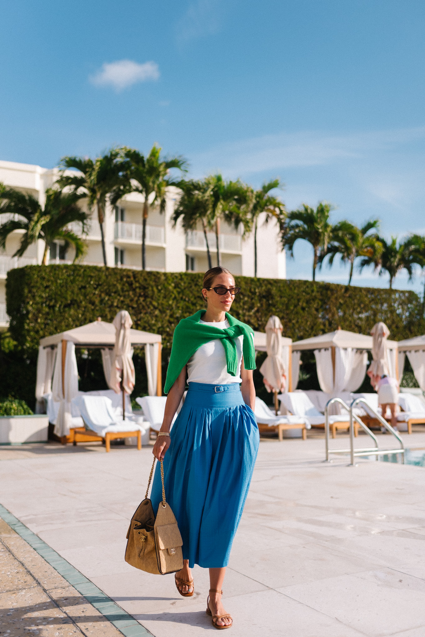 white tshirt green sweater blue maxi skirt raffia tote