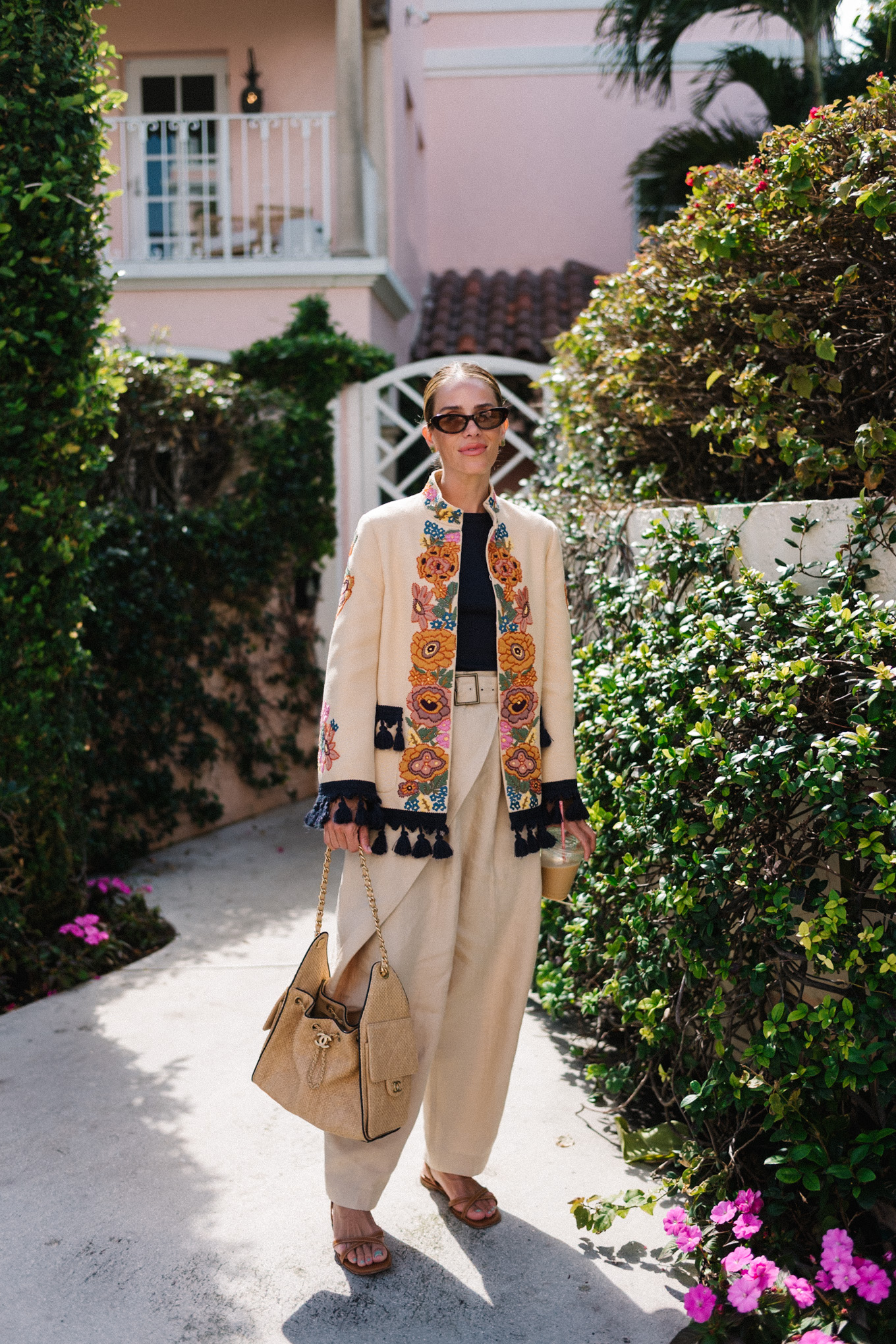 embroidered jacket black tee linen barrel leg pants brown leather strappy sandals